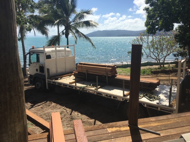 Platypus Timbers truck delivering hardwood timber to a beachfront job site near Mackay