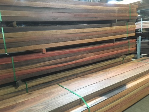 Packs of oiled hardwood timber boards at the Platypus Timbers yard in Mackay